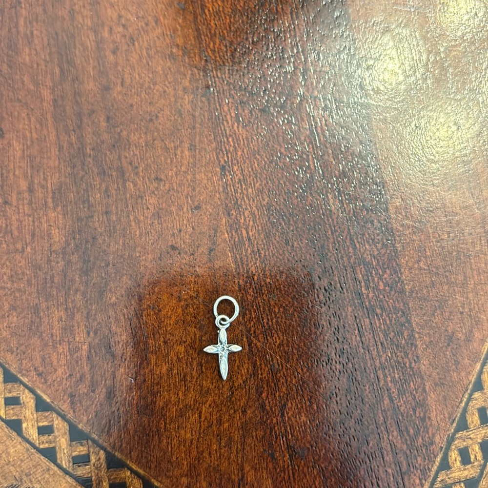 Tiny sterling silver cross charm